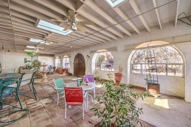 view of patio with ceiling fan and outdoor dining space