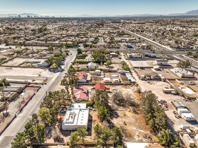 drone / aerial view with a residential view and a mountain view