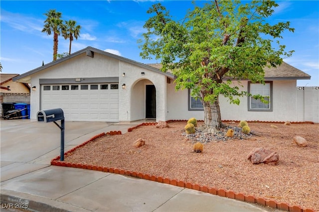 ranch-style home featuring concrete driveway, stucco siding, and a garage