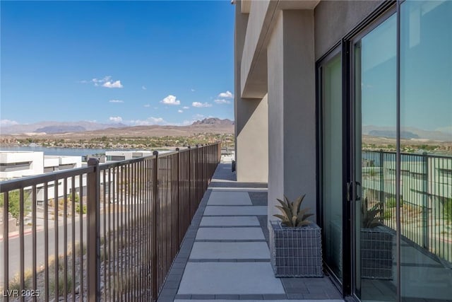 balcony with a water and mountain view