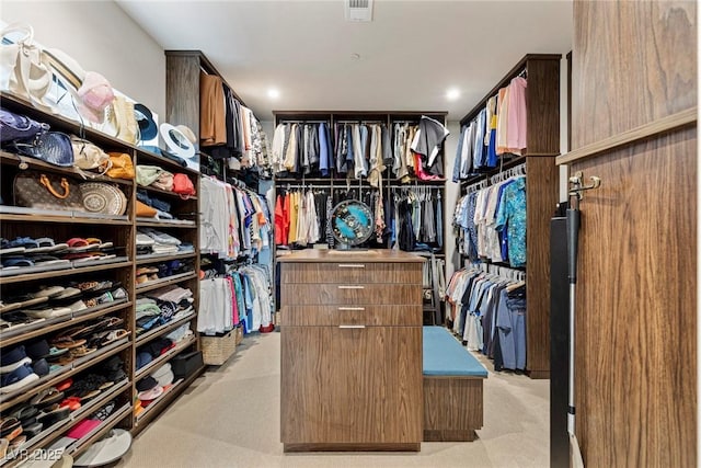 spacious closet with light carpet and visible vents