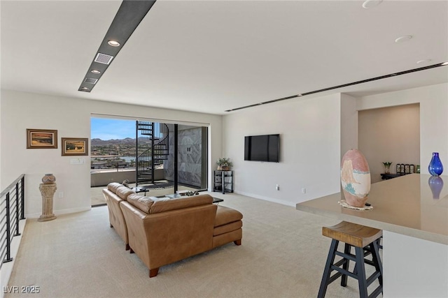 living room featuring baseboards, recessed lighting, light carpet, and visible vents