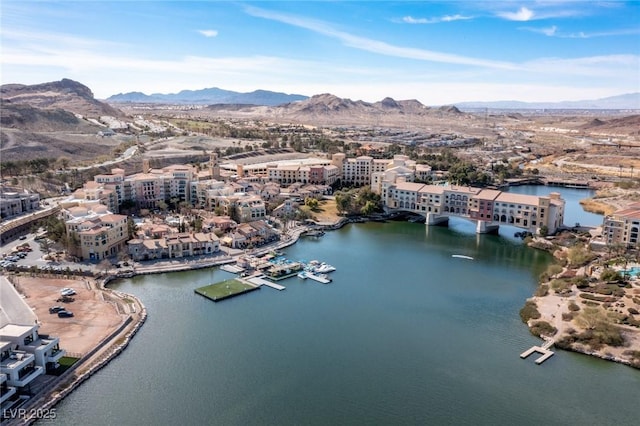 aerial view featuring a water and mountain view