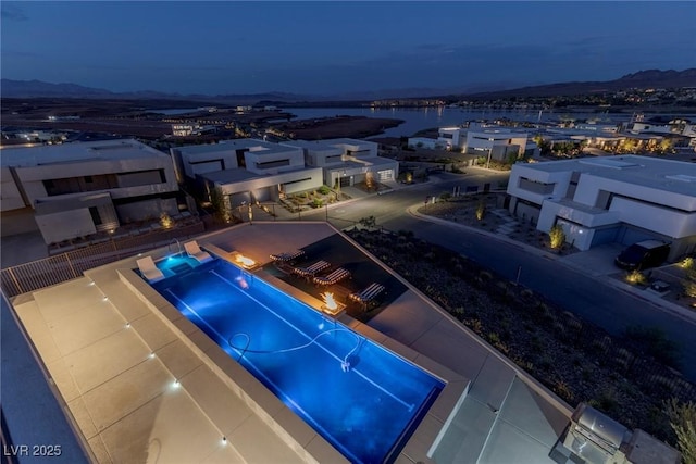 view of pool with a water view