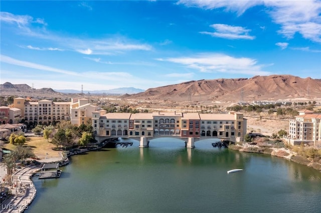 aerial view featuring a water and mountain view