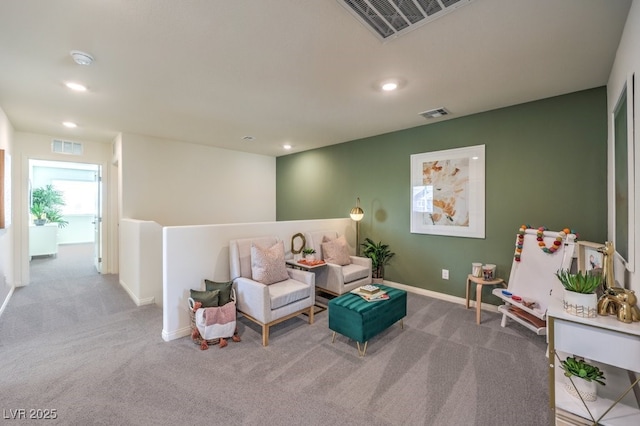 sitting room featuring carpet flooring, baseboards, visible vents, and recessed lighting