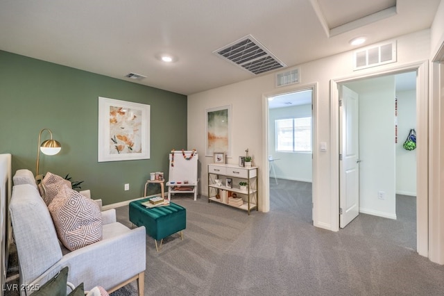 sitting room with carpet and visible vents