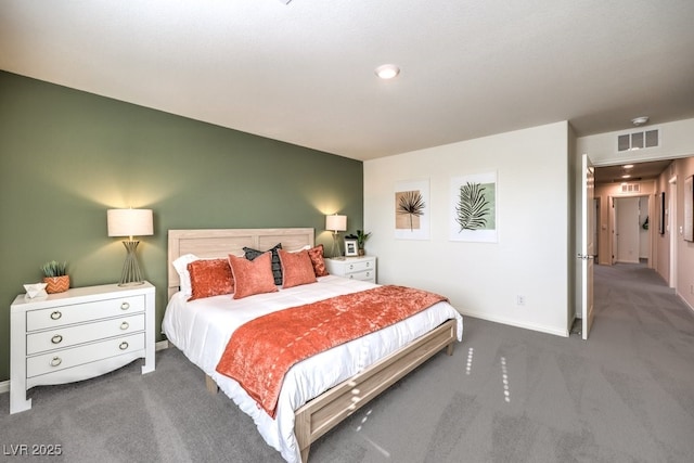 carpeted bedroom featuring baseboards and visible vents