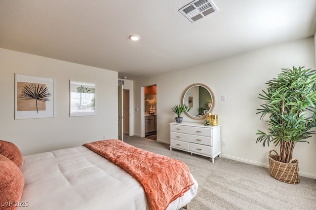 bedroom with baseboards, light carpet, connected bathroom, and visible vents