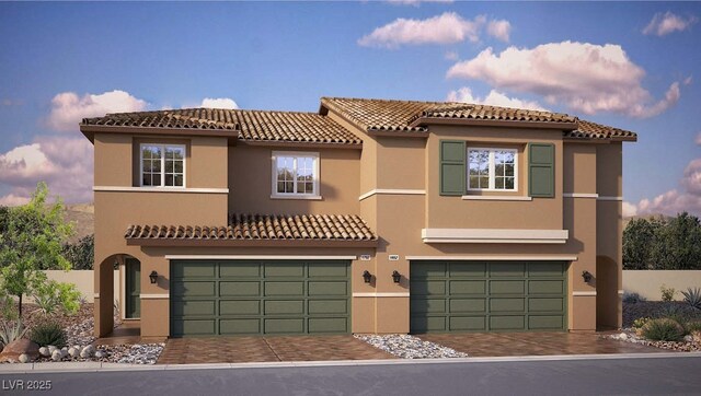 view of front of house featuring stucco siding, a tile roof, and a garage