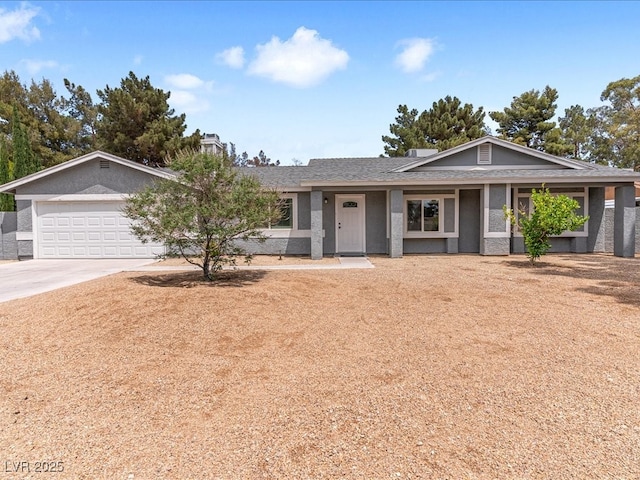 ranch-style house featuring concrete driveway, an attached garage, a shingled roof, and a chimney