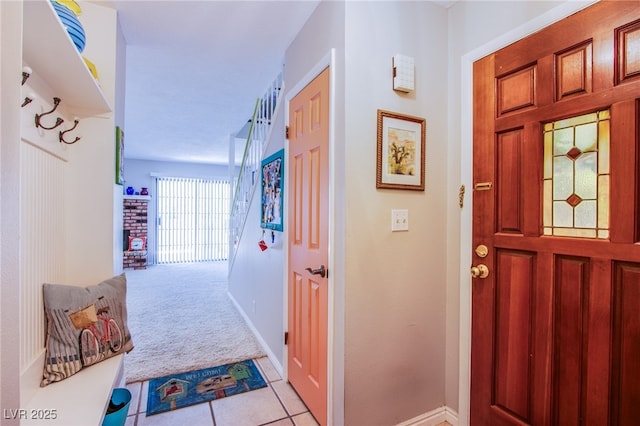 3249 Dayflower St Unit C, Las Vegas, NV 89121 - entryway featuring light colored carpet, baseboards, and light tile patterned flooring