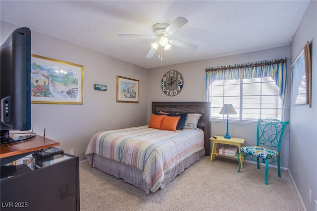 3249 Dayflower St Unit C, Las Vegas, NV 89121 - bedroom with light carpet, baseboards, and ceiling fan