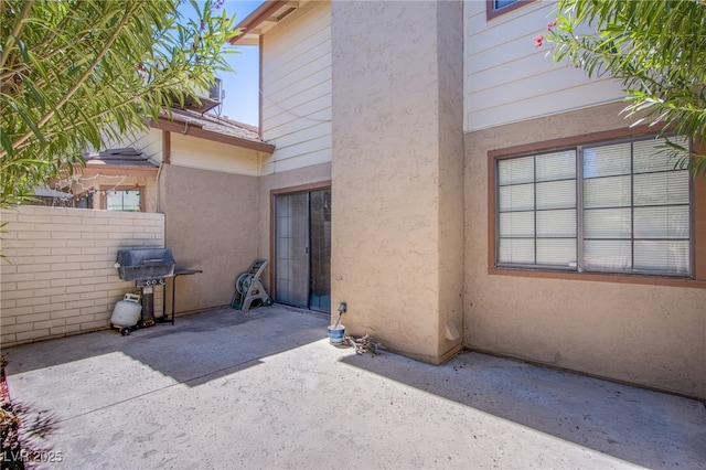3249 Dayflower St Unit C, Las Vegas, NV 89121 - entrance to property with a patio area, stucco siding, and fence