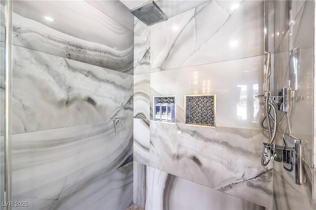 full bath with a marble finish shower