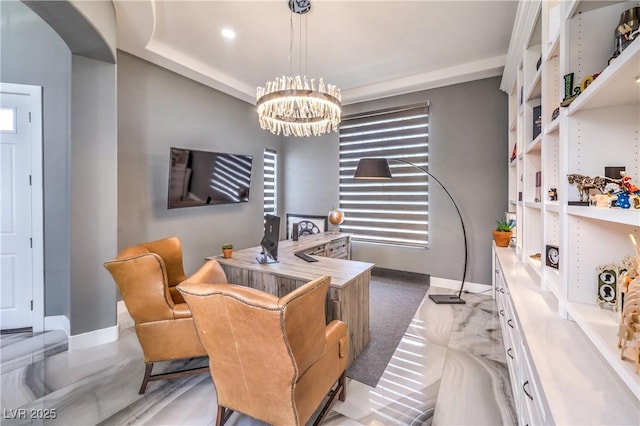 office area with baseboards and a notable chandelier