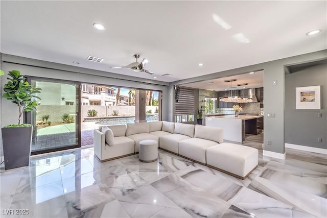 living area featuring a ceiling fan, marble finish floor, recessed lighting, and visible vents