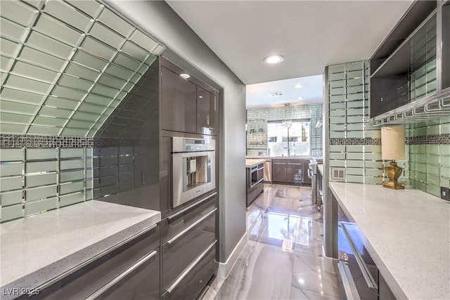 kitchen with stainless steel oven, recessed lighting, backsplash, and open shelves