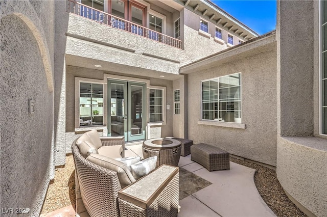 view of patio featuring a balcony