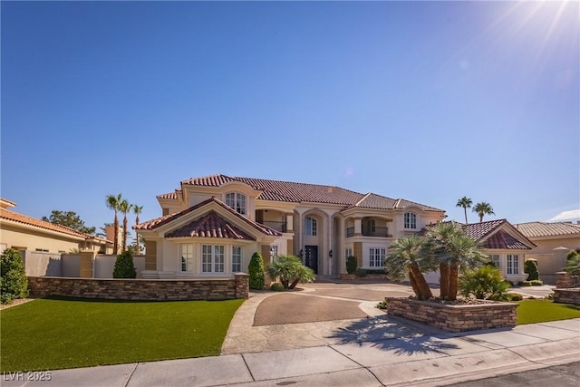 35 Ventana Canyon Dr, Las Vegas, NV 89113 - mediterranean / spanish-style home featuring a front lawn, a tiled roof, and stucco siding