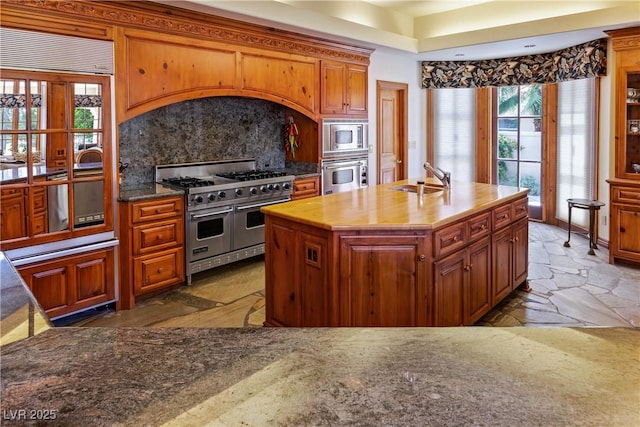 35 Ventana Canyon Dr, Las Vegas, NV 89113 - kitchen featuring built in appliances, backsplash, plenty of natural light, and a sink