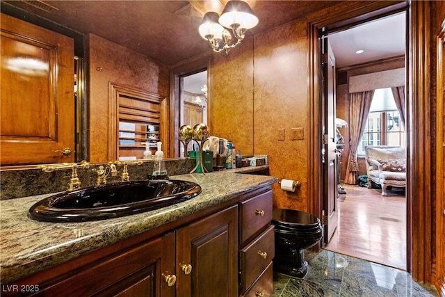 35 Ventana Canyon Dr, Las Vegas, NV 89113 - bathroom with toilet, marble finish floor, a notable chandelier, and vanity