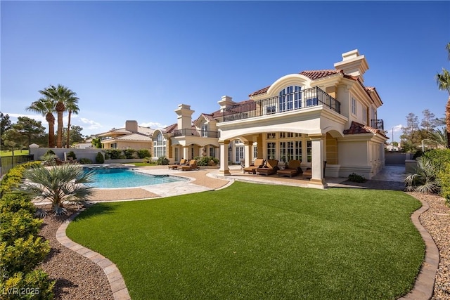 35 Ventana Canyon Dr, Las Vegas, NV 89113 - rear view of property featuring a patio, an outdoor living space, a balcony, a yard, and a fenced in pool