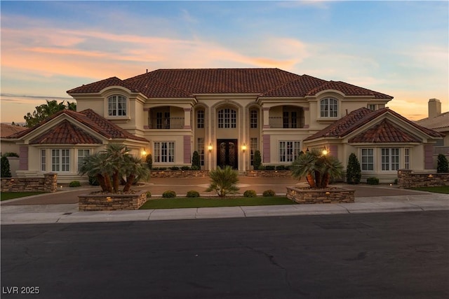 35 Ventana Canyon Dr, Las Vegas, NV 89113 - mediterranean / spanish-style home with a tiled roof, stucco siding, french doors, and curved driveway