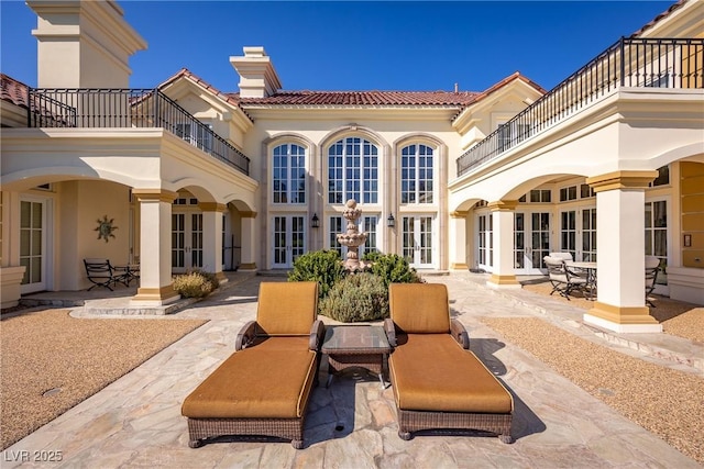 35 Ventana Canyon Dr, Las Vegas, NV 89113 - rear view of house with a patio area, french doors, and a balcony