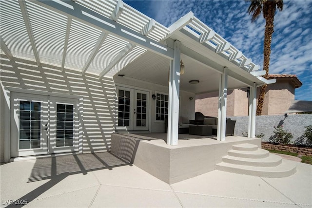 view of patio / terrace featuring a pergola and french doors