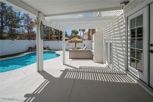 view of pool featuring a patio area, a fenced in pool, and a fenced backyard