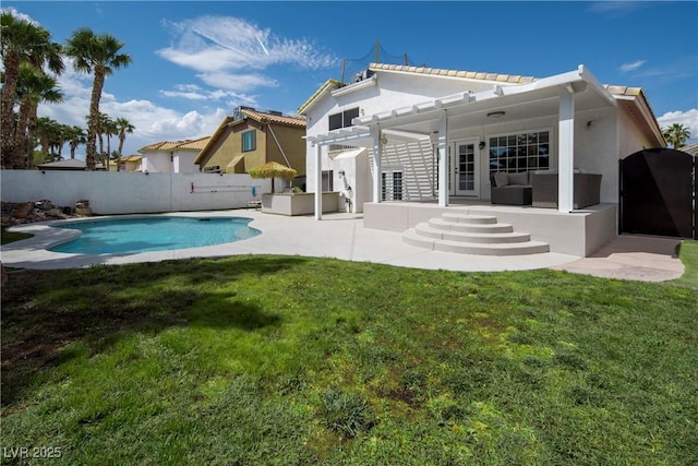 rear view of property with a yard, a patio, an outdoor living space, a pergola, and a fenced backyard