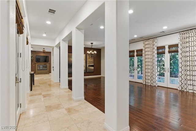 12056 Royal Dolnoch Ct, Las Vegas, NV 89141 - corridor with a chandelier, french doors, visible vents, and recessed lighting