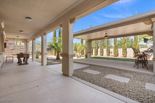 view of patio / terrace featuring fence