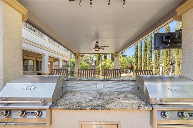 view of patio / terrace featuring area for grilling, a grill, and a ceiling fan