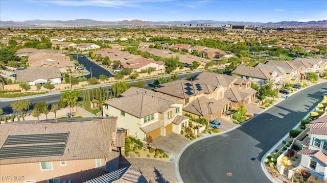 birds eye view of property with a mountain view and a residential view