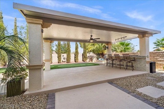 surrounding community with a patio area, fence private yard, and outdoor dry bar