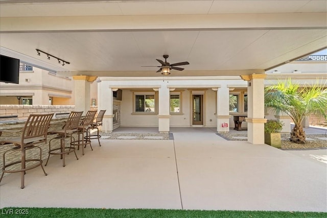 view of patio / terrace with ceiling fan and outdoor dry bar