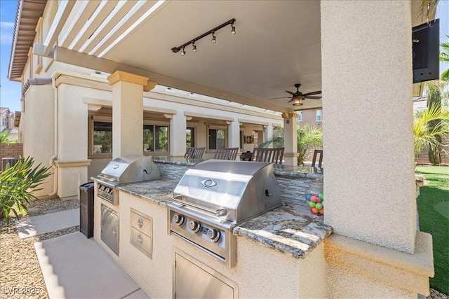 view of patio / terrace with grilling area, an outdoor kitchen, and a ceiling fan