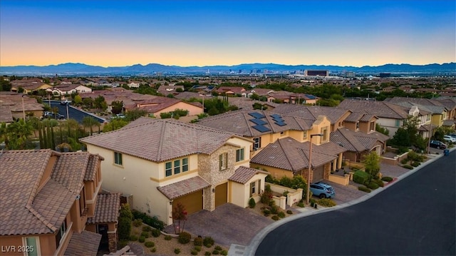 drone / aerial view featuring a mountain view and a residential view