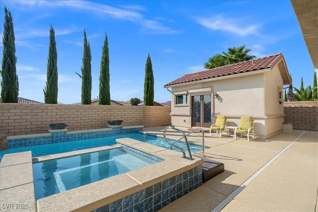 view of pool with an in ground hot tub, french doors, a fenced backyard, a patio area, and a fenced in pool