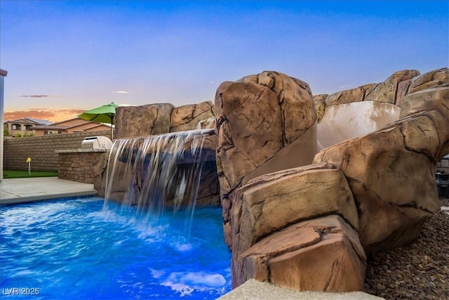 12219 Crystal Shore Ave, Las Vegas, NV 89138 - view of swimming pool featuring an outdoor kitchen
