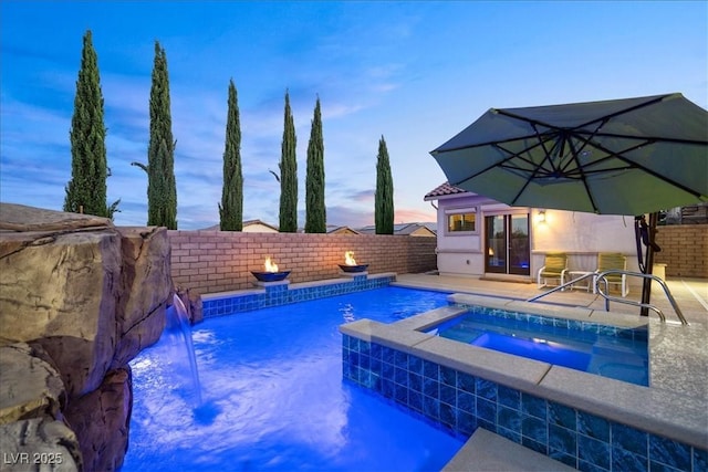 view of pool with french doors, an in ground hot tub, a fenced backyard, and a fenced in pool