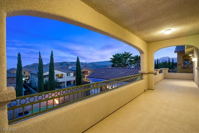 balcony featuring a mountain view and a residential view