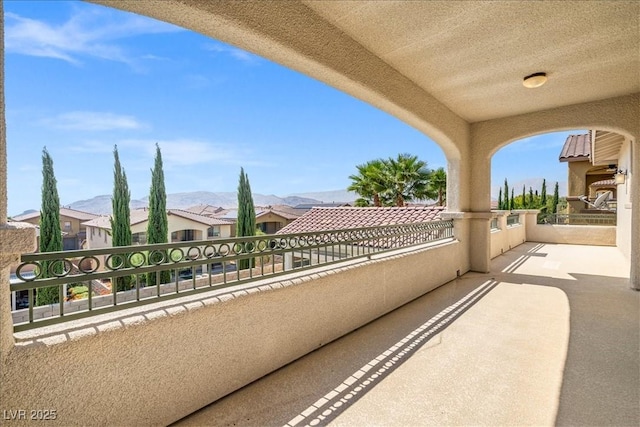 balcony featuring a mountain view and a residential view