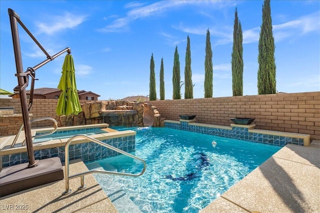 view of swimming pool with a fenced backyard and a fenced in pool