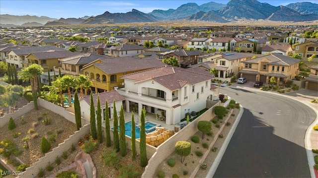 birds eye view of property with a mountain view and a residential view