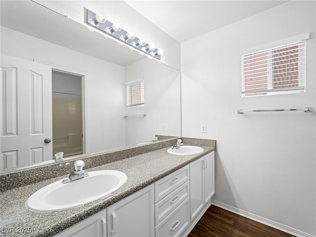 1153 Stormy Valley Rd, Las Vegas, NV 89123 - full bath with baseboards, double vanity, wood finished floors, and a shower