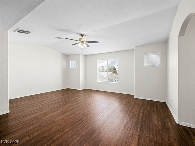 1153 Stormy Valley Rd, Las Vegas, NV 89123 - unfurnished room featuring wood finished floors, arched walkways, a ceiling fan, baseboards, and lofted ceiling