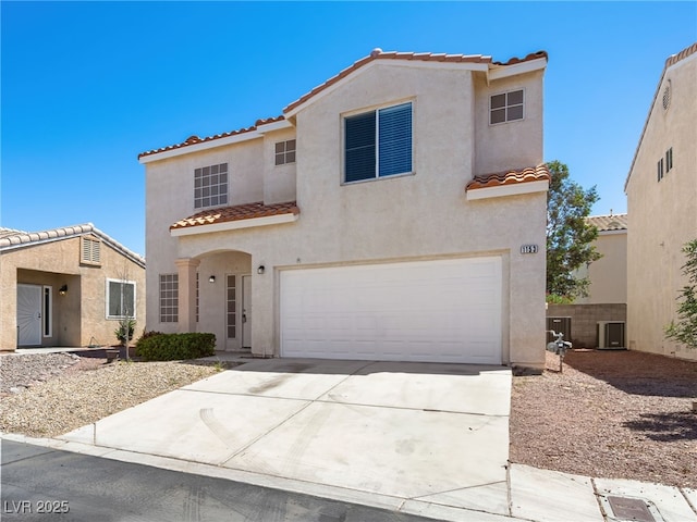 1153 Stormy Valley Rd, Las Vegas, NV 89123 - mediterranean / spanish-style house with a tiled roof, an attached garage, stucco siding, central AC unit, and concrete driveway